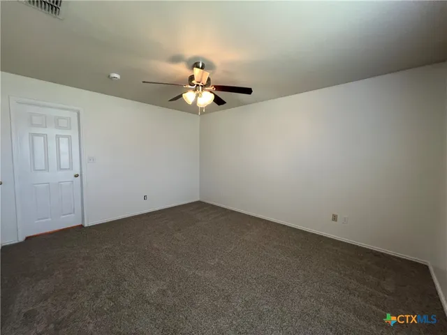 a view of a big room with carpet