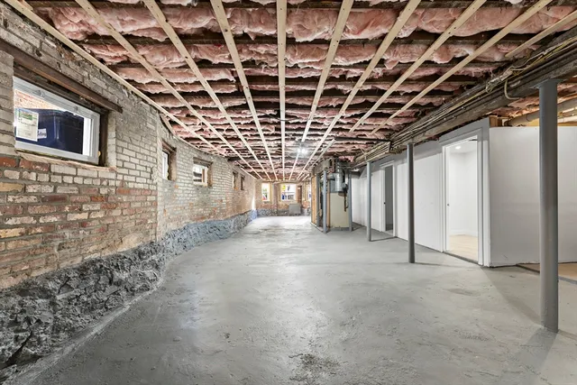 a big room with closet next to a large window