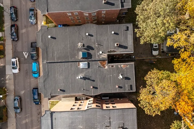 a view of a building with a yard