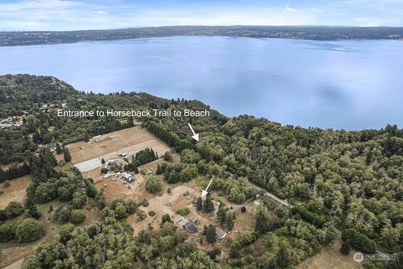 5606 Southwest 244th Street Vashon, WA 98070 - Photo 31 of 40 a view of a lake in middle of the forest