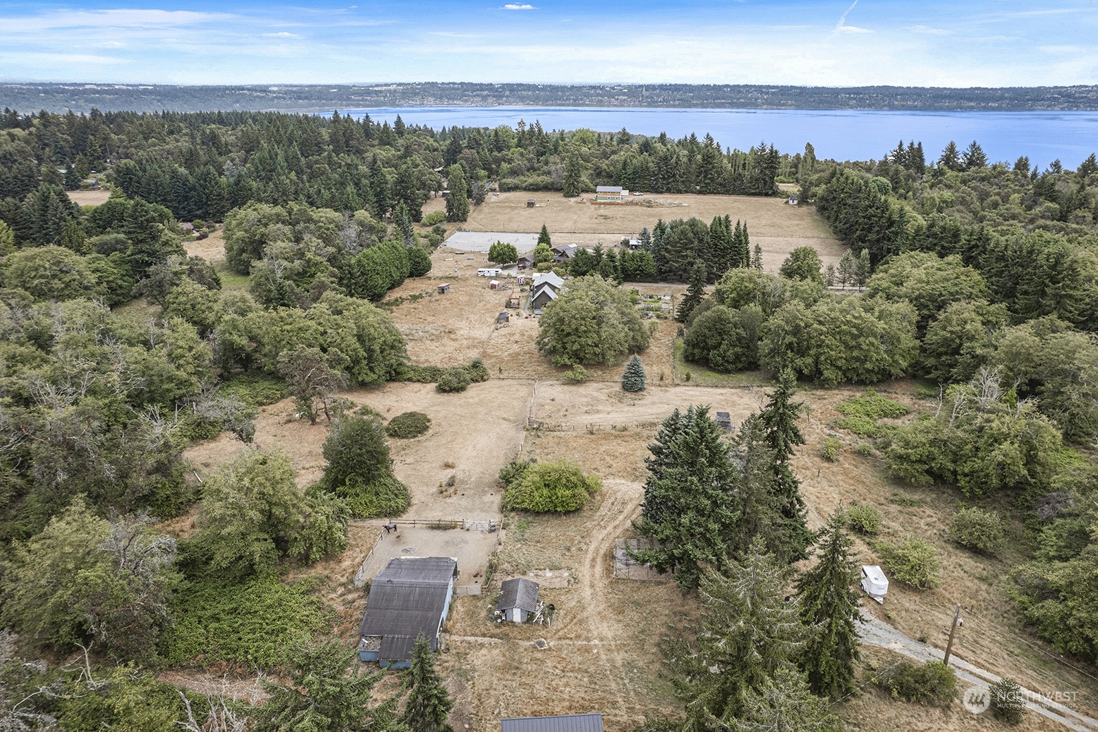 5606 Southwest 244th Street Vashon, WA 98070 - Photo 35 of 40 an aerial view of a city with lots of residential buildings ocean and mountain view in back