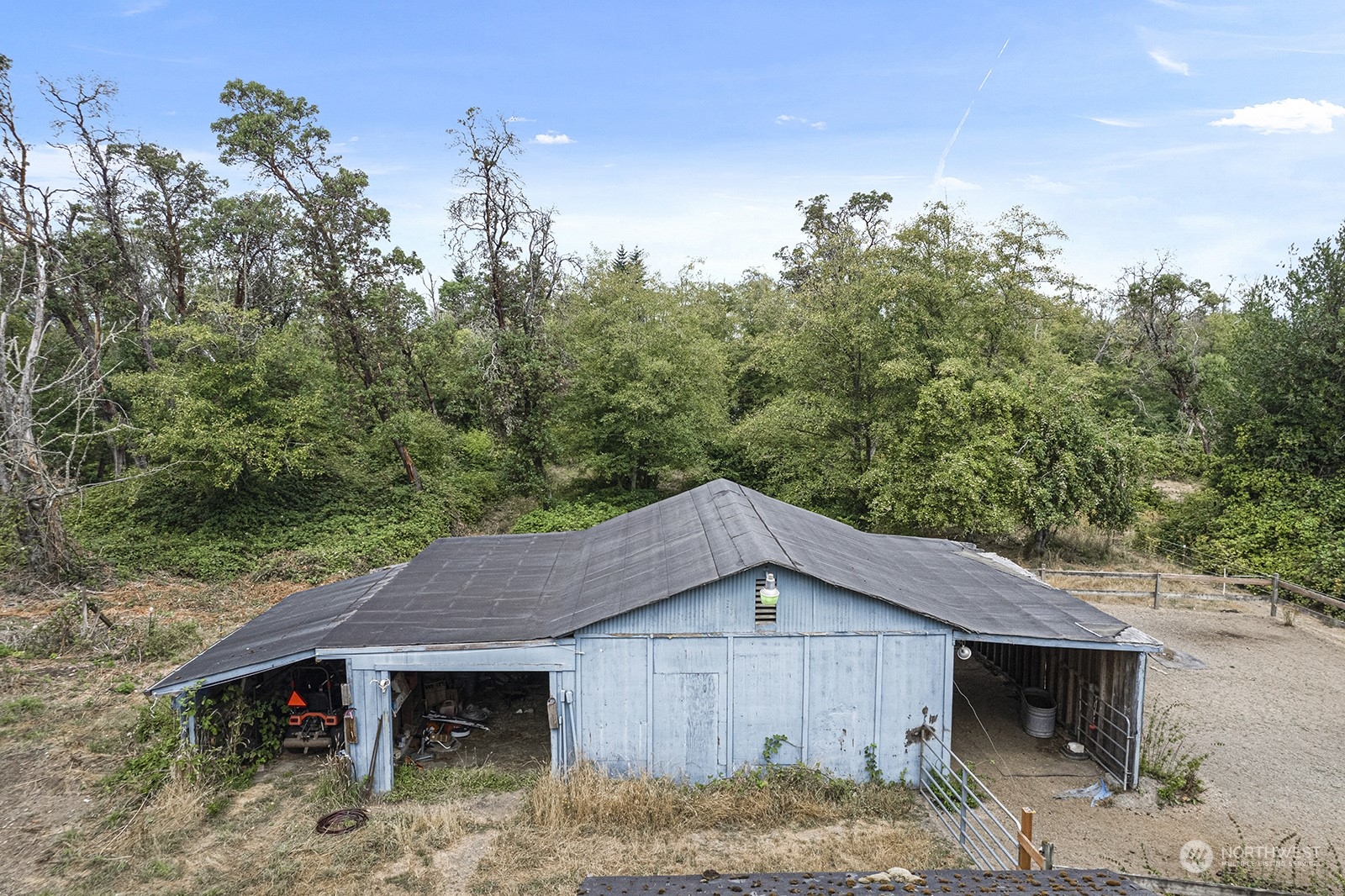 5606 Southwest 244th Street Vashon, WA 98070 - Photo 38 of 40 a house with trees in front of it