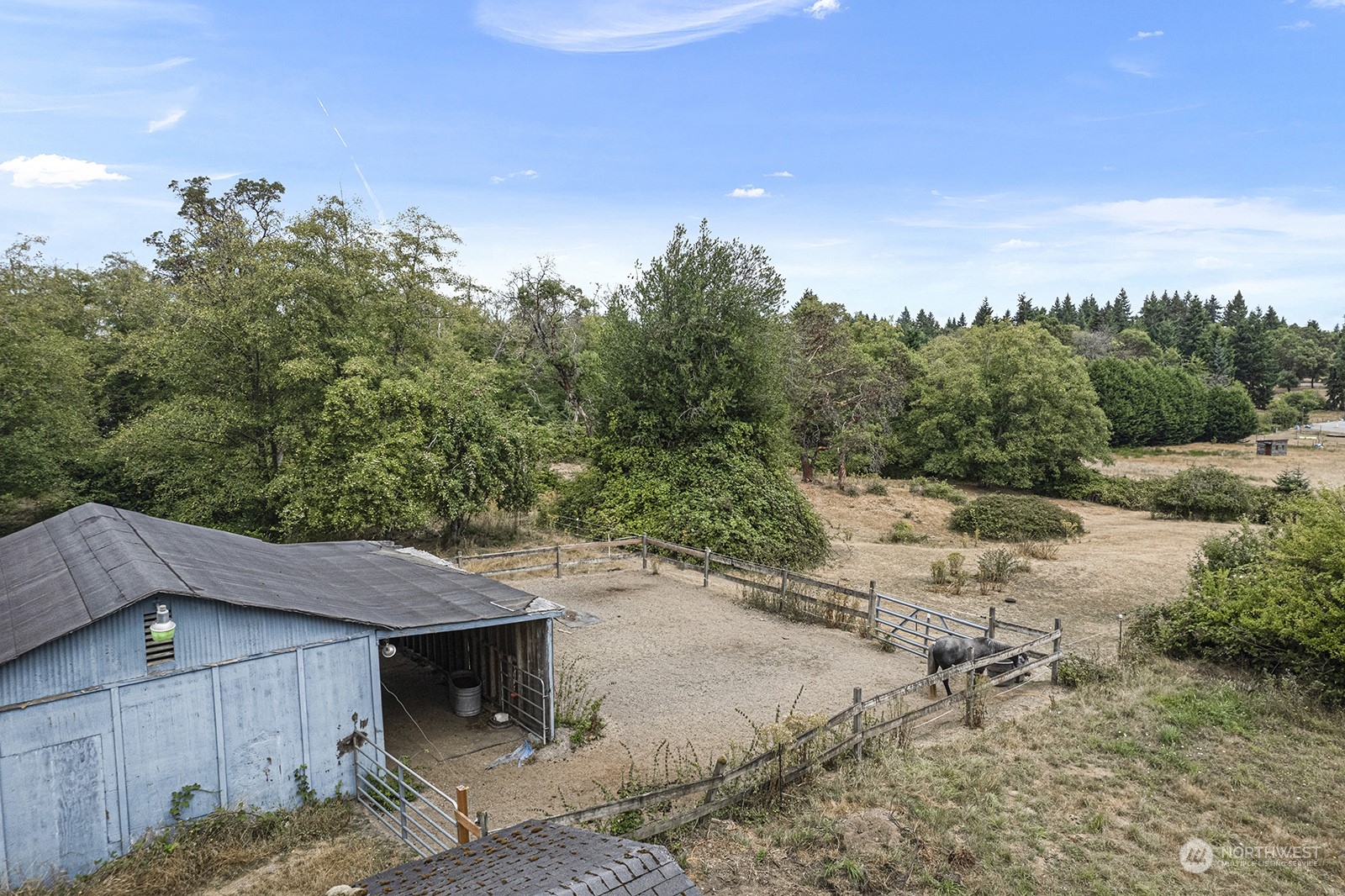 5606 Southwest 244th Street Vashon, WA 98070 - Photo 39 of 40 a view of a house with a yard