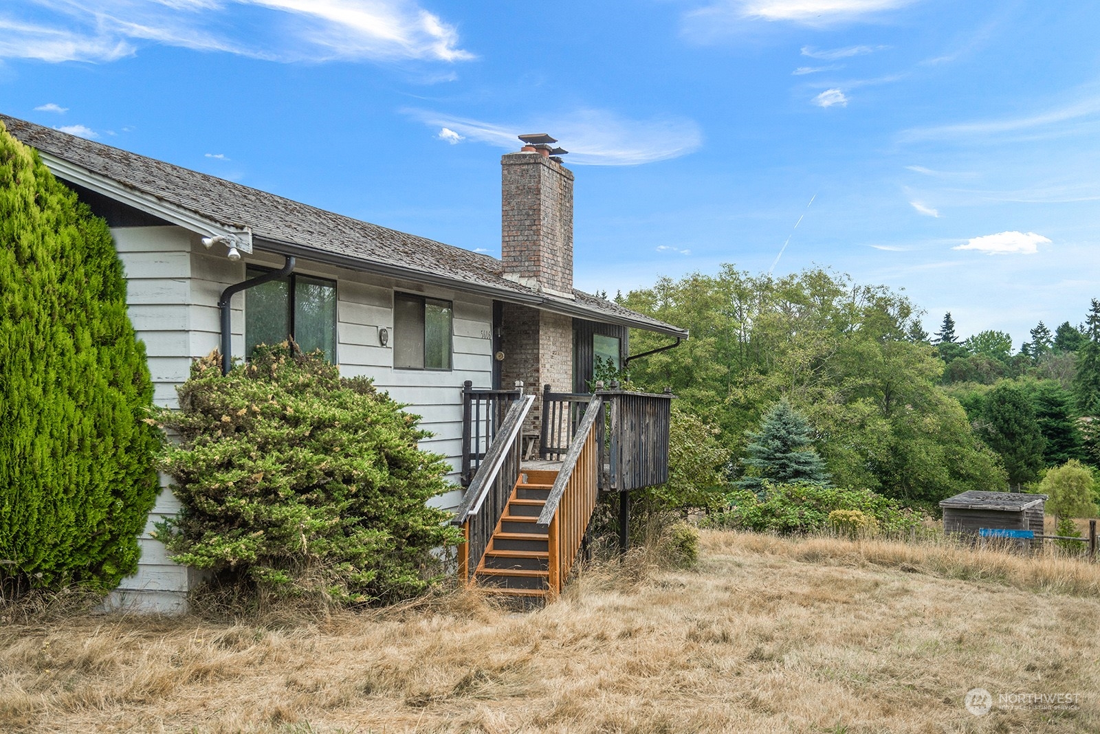 5606 Southwest 244th Street Vashon, WA 98070 - Photo 4 of 40 a front view of a house with plants