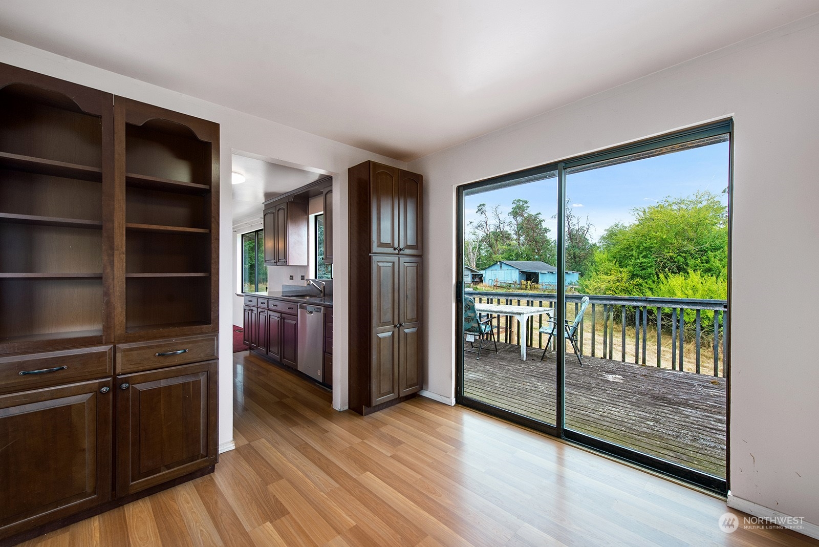 5606 Southwest 244th Street Vashon, WA 98070 - Photo 8 of 40 a view of empty room with wooden floor and cabinet