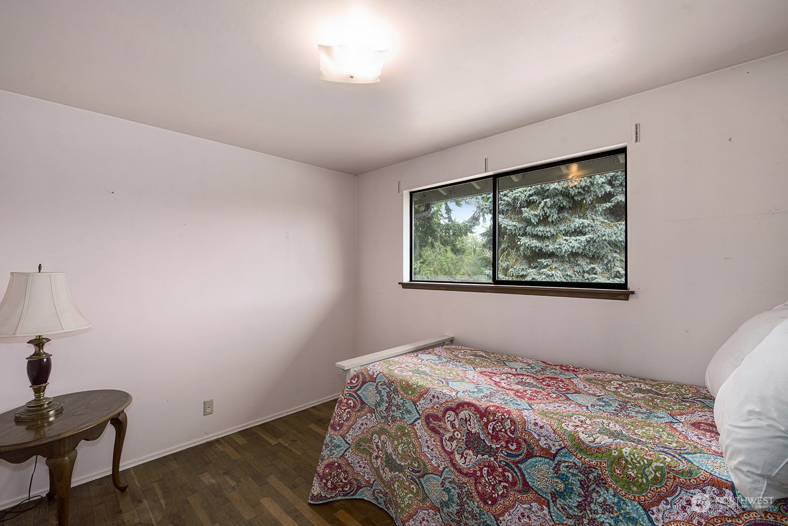 5606 Southwest 244th Street Vashon, WA 98070 - Photo 9 of 40 a bedroom with a bed and a window
