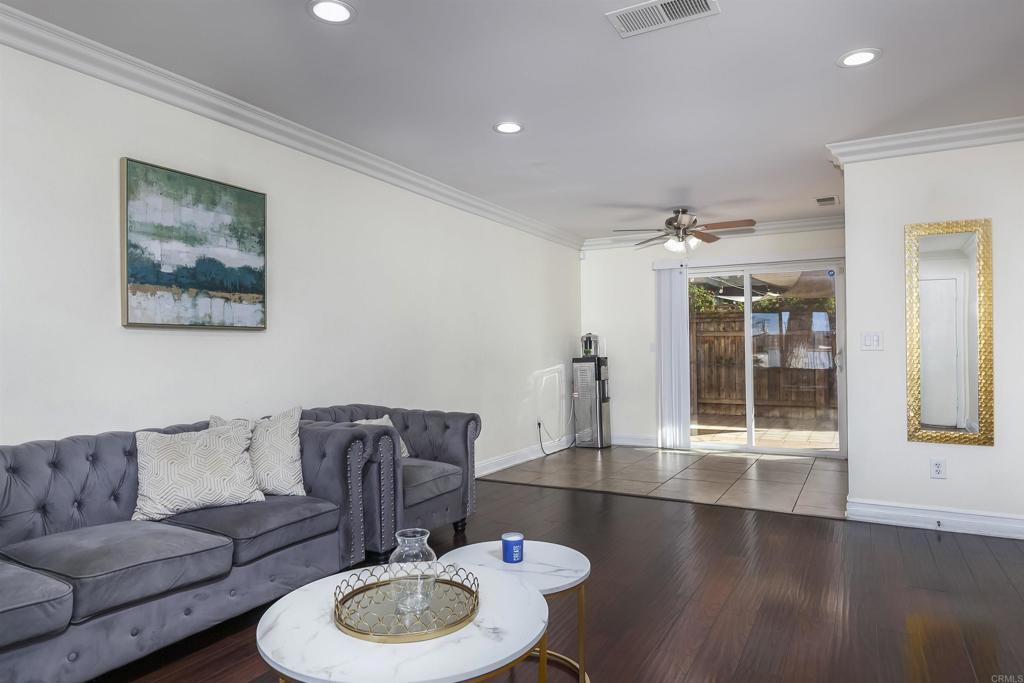 309 Sun Court El Cajon, CA 92021 - Photo 12 of 39 a living room with furniture and wooden floor