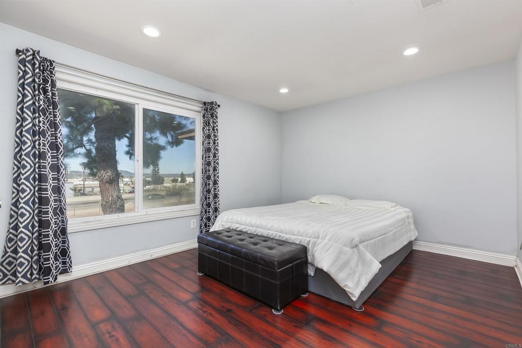 309 Sun Court El Cajon, CA 92021 - Photo 20 of 39 a bed sitting in a spacious bedroom next to a window