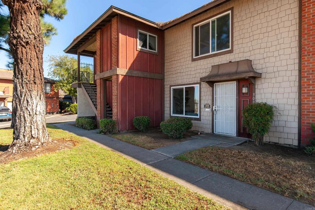 309 Sun Court El Cajon, CA 92021 - Photo 2 of 39 a front view of a house with garden