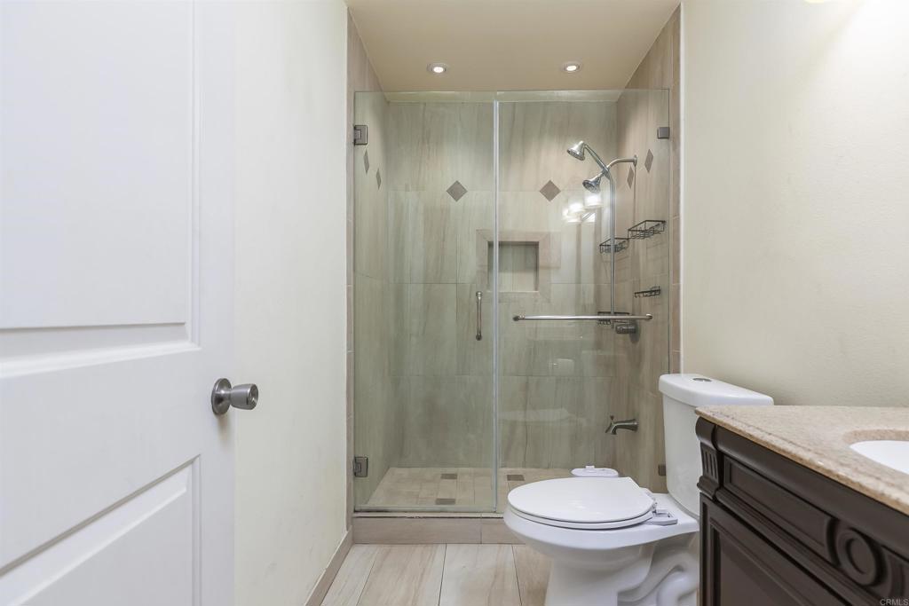 309 Sun Court El Cajon, CA 92021 - Photo 24 of 39 a bathroom with a shower a toilet and a sink