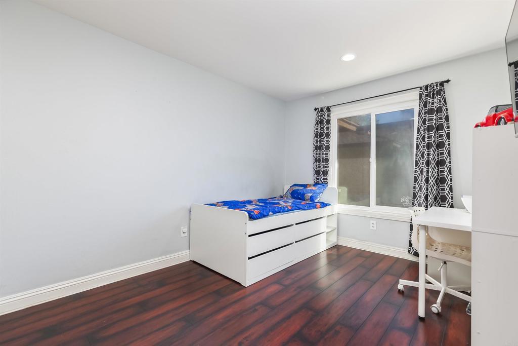 309 Sun Court El Cajon, CA 92021 - Photo 25 of 39 a living room with hard wood floors and white walls