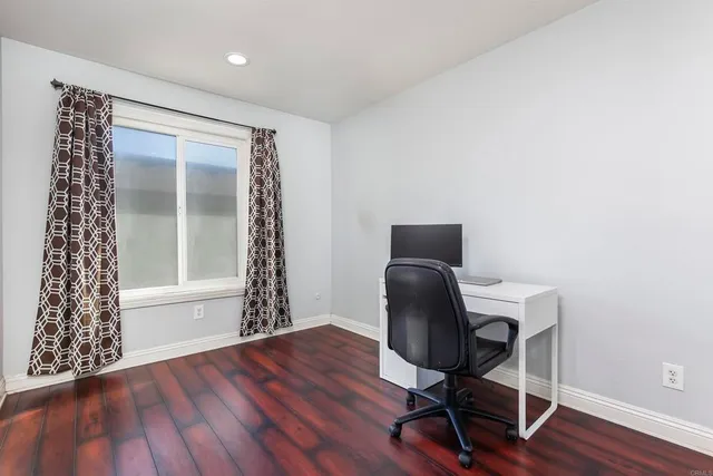 a workspace with furniture and wooden floor