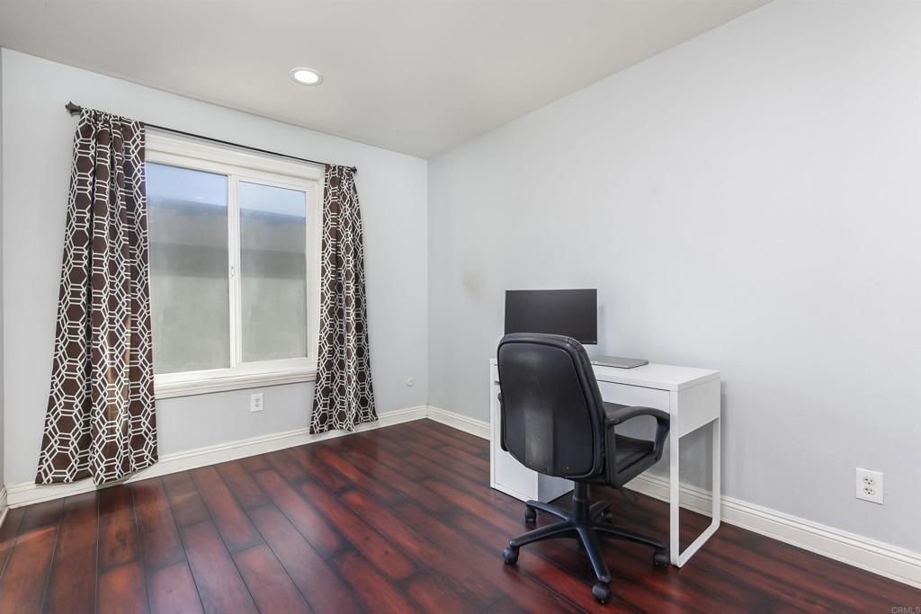 309 Sun Court El Cajon, CA 92021 - Photo 27 of 39 a workspace with furniture and wooden floor
