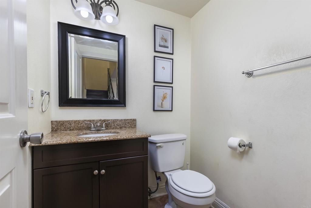 309 Sun Court El Cajon, CA 92021 - Photo 29 of 39 a bathroom with a toilet sink and mirror