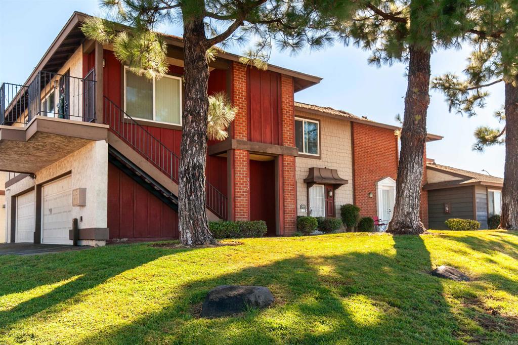 309 Sun Court El Cajon, CA 92021 - Photo 4 of 39 a view of a house with a yard