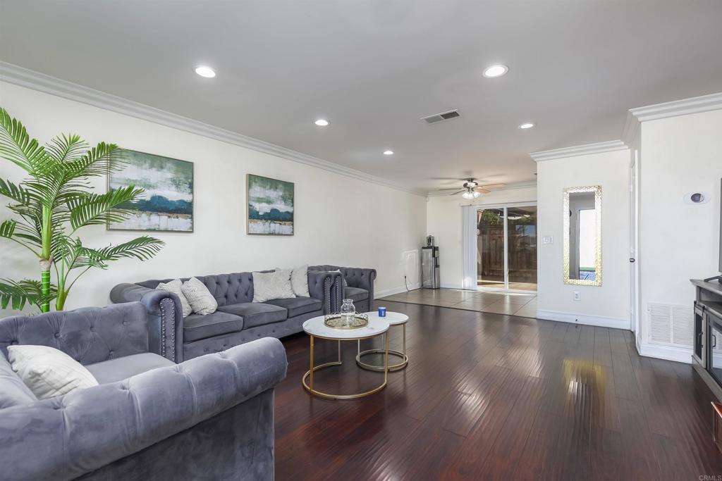 309 Sun Court El Cajon, CA 92021 - Photo 10 of 39 a living room with furniture and a wooden floor