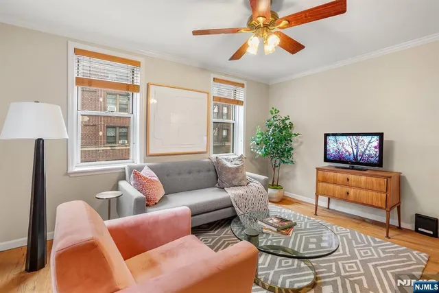 a living room with furniture a table and a window