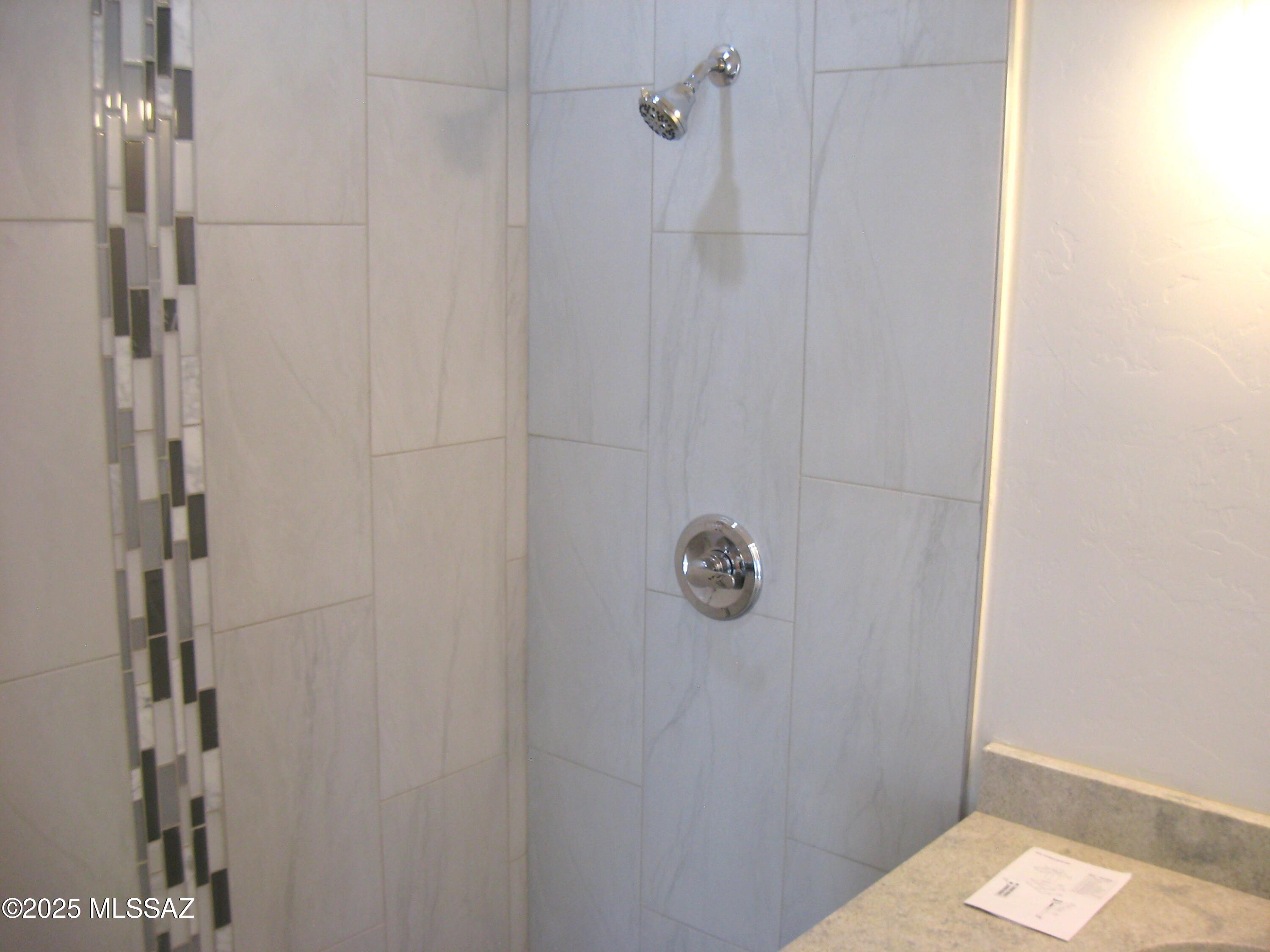 1734 Circulo Badajada Rio Rico, AZ 85648 - Photo 21 of 32 a bathroom with a shower and a sink