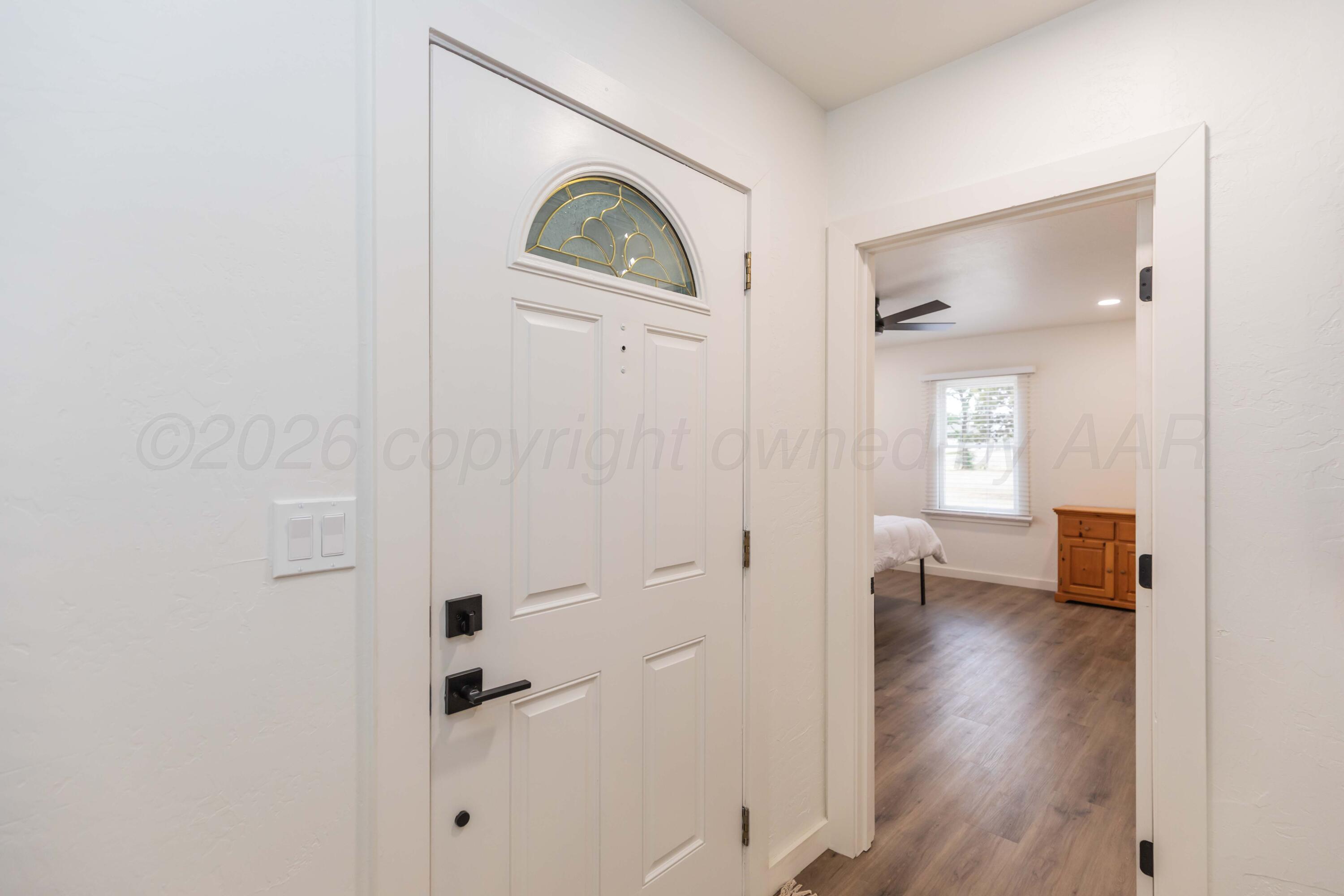 504 High Street Claude, TX 79019 - Photo 16 of 39 wooden floor with white walls