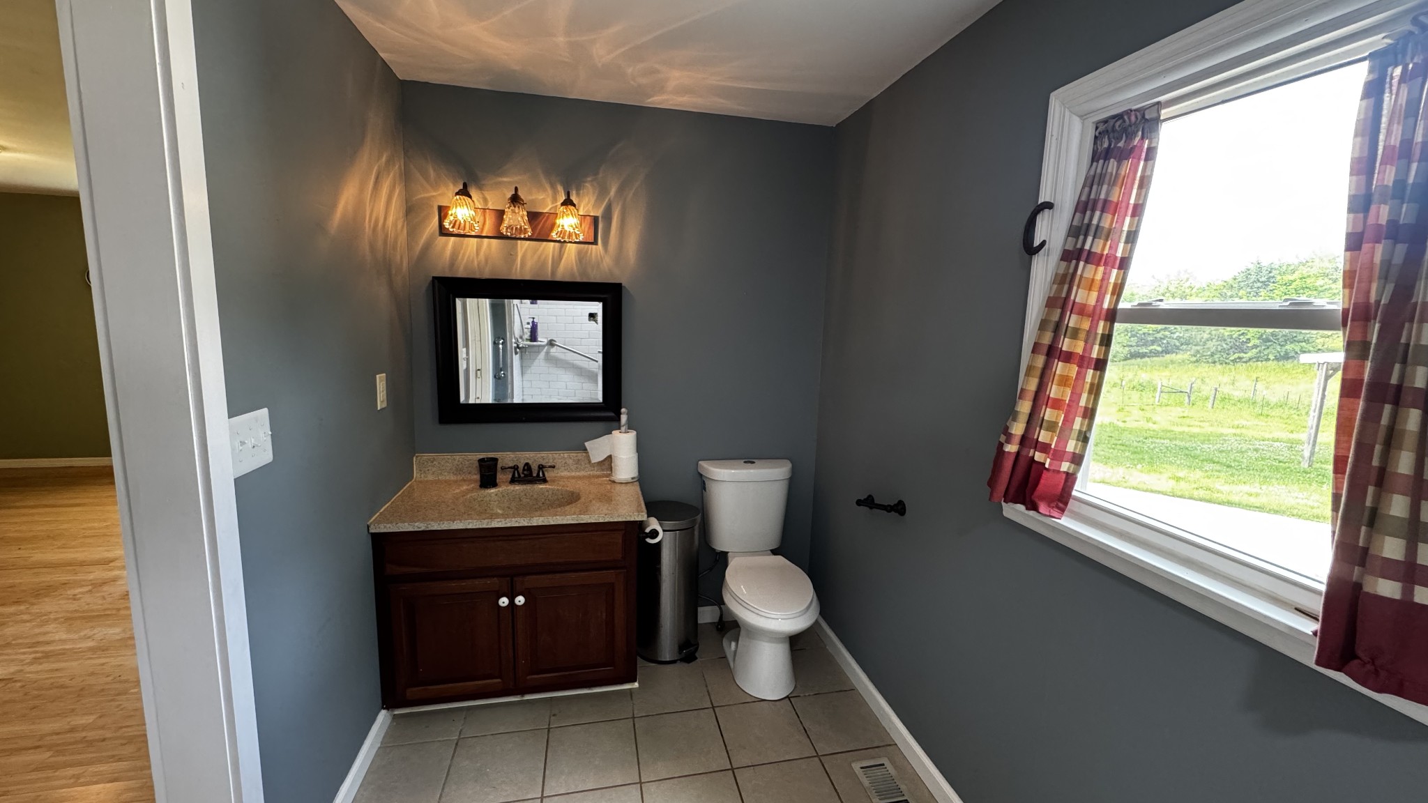 315 Loyd Road Pulaski, TN 38478 - Photo 15 of 73 a bathroom with a toilet sink and mirror