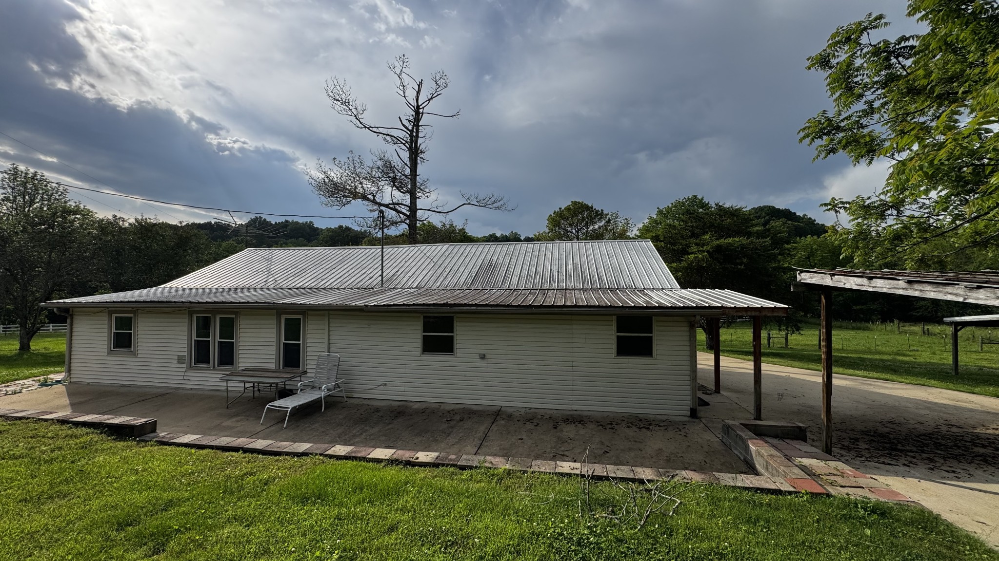 315 Loyd Road Pulaski, TN 38478 - Photo 31 of 73 a backyard of a house with table and chairs