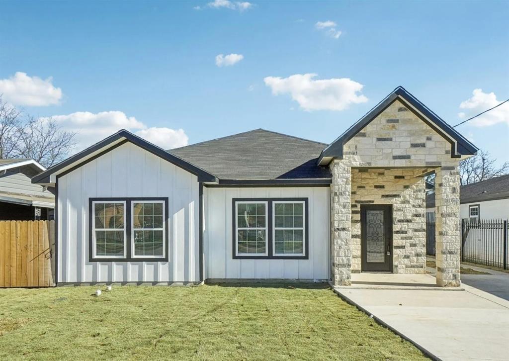 3853 Stalcup Road Fort Worth, TX 76119 - Photo 2 of 10 front view of a house with a yard