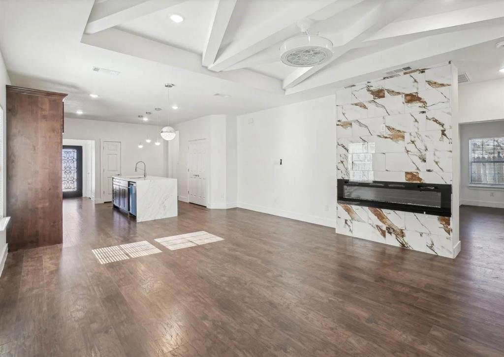 3853 Stalcup Road Fort Worth, TX 76119 - Photo 8 of 10 a view of a hallway with wooden floor and seating space
