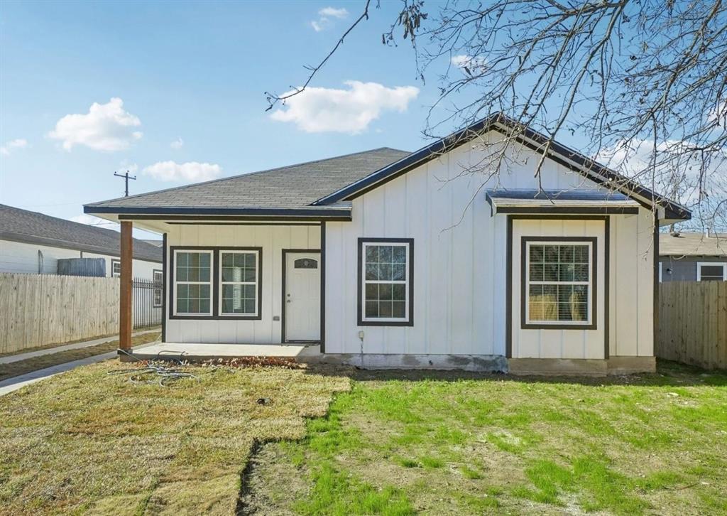 3853 Stalcup Road Fort Worth, TX 76119 - Photo 9 of 10 a view of a house with a yard