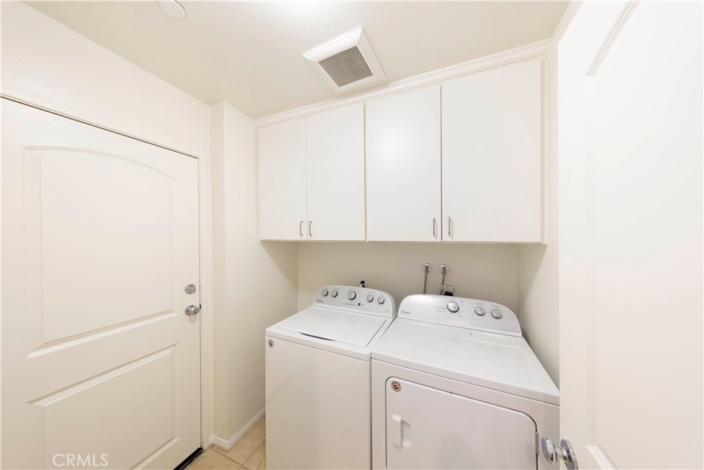 90 Hedge Bloom Irvine, CA 92618 - Photo 11 of 22 a utility room with dryer and washer
