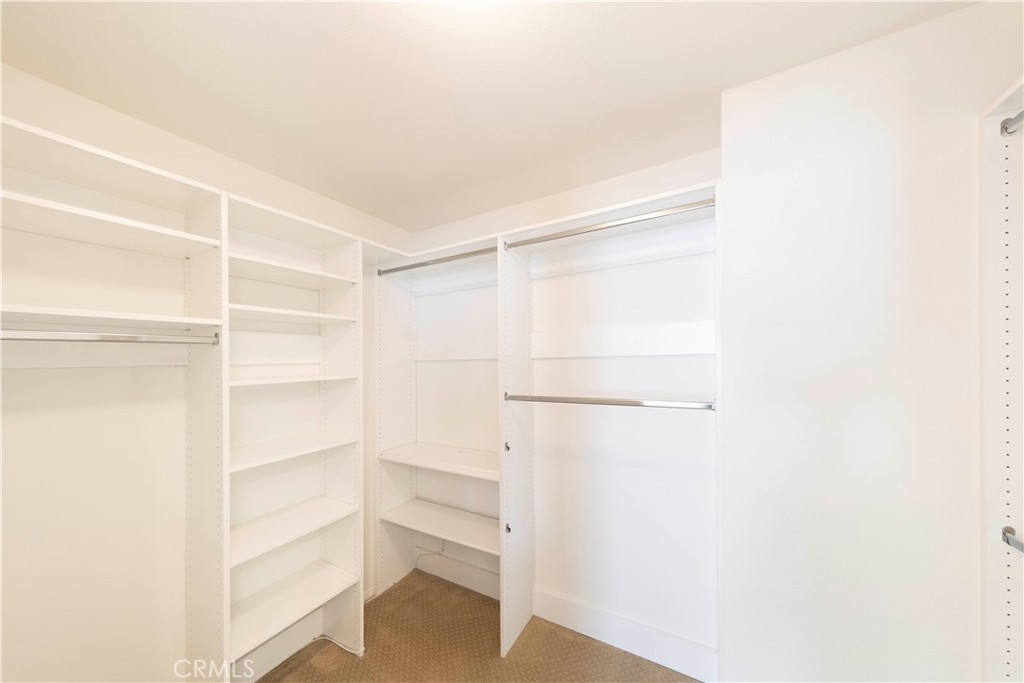90 Hedge Bloom Irvine, CA 92618 - Photo 15 of 22 a view of walk in closet with empty racks