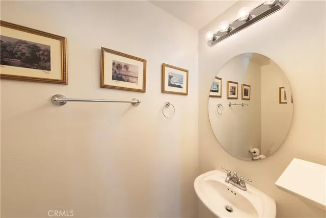 a bathroom with a sink and mirror