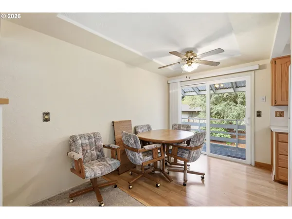 a dining room with furniture and window