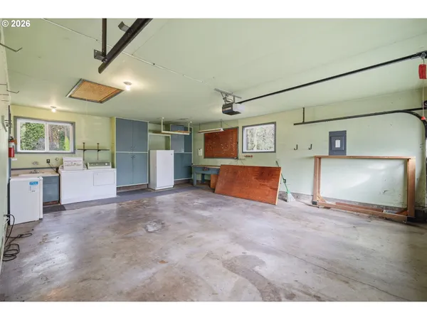a view of a livingroom with furniture and a kitchen