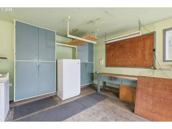 a kitchen with a refrigerator and a sink
