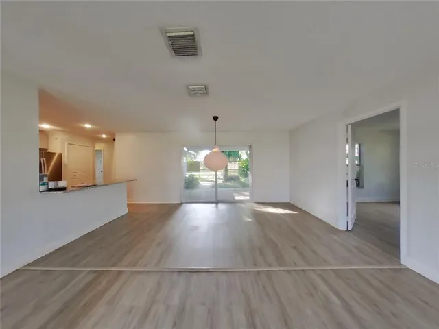 a view of a livingroom with wooden floor