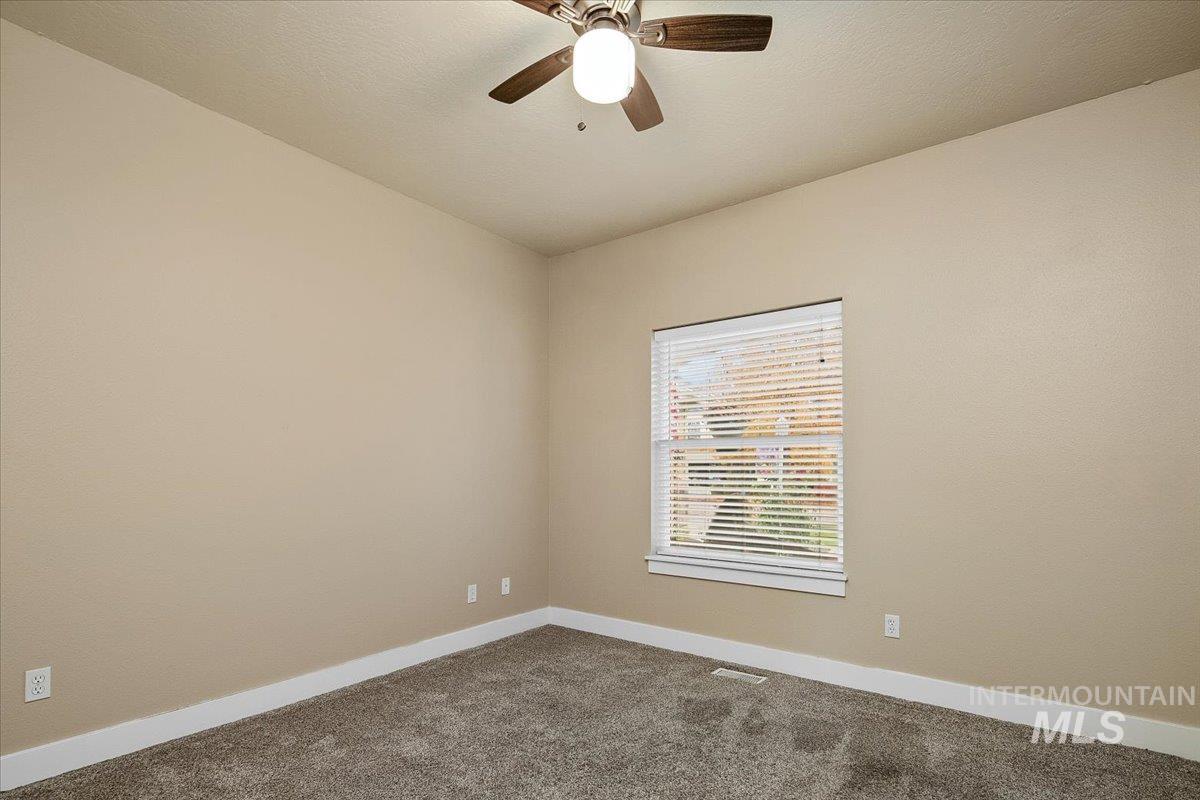 2264 East Comisky Street Meridian, ID 83646 - Photo 25 of 47 Spare room featuring carpet and ceiling fan