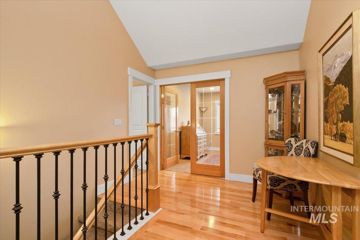 2264 East Comisky Street Meridian, ID 83646 - Photo 27 of 47 Hallway featuring light wood finished floors and an upstairs landing