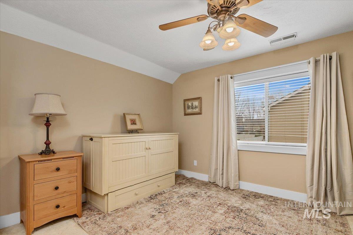 2264 East Comisky Street Meridian, ID 83646 - Photo 33 of 47 Bedroom with lofted ceiling and a ceiling fan