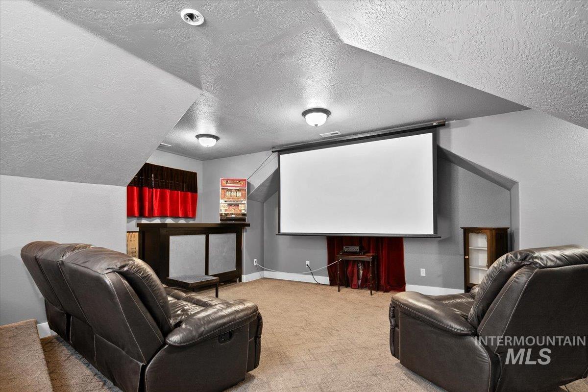 2264 East Comisky Street Meridian, ID 83646 - Photo 35 of 47 Home theater room with a textured ceiling and light colored carpet