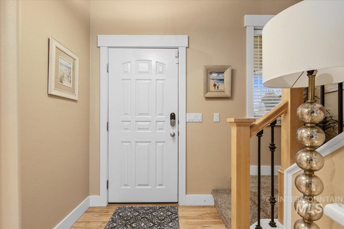 2264 East Comisky Street Meridian, ID 83646 - Photo 6 of 47 Entryway with light wood-style floors and stairway