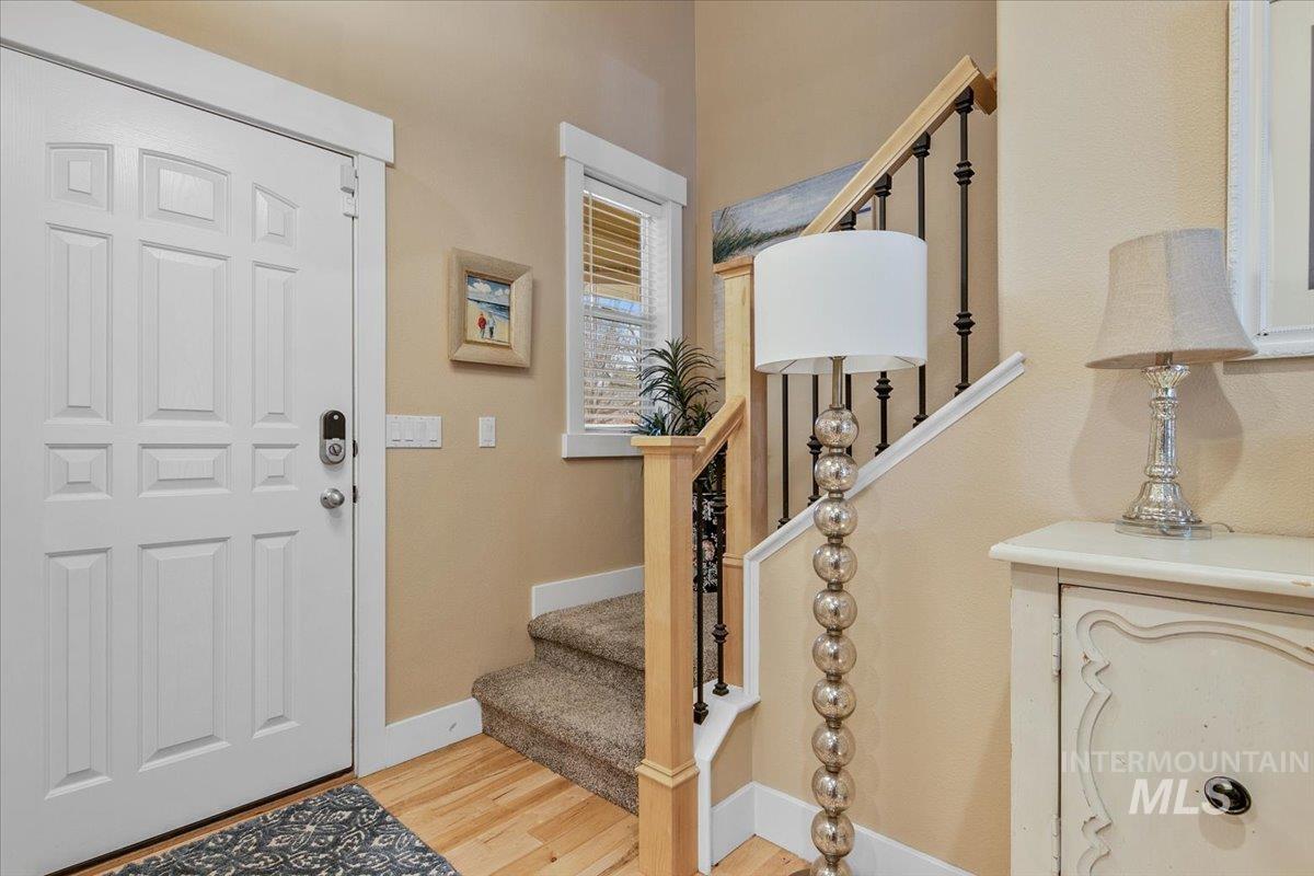 2264 East Comisky Street Meridian, ID 83646 - Photo 7 of 47 Entrance foyer featuring stairs and light wood-type flooring