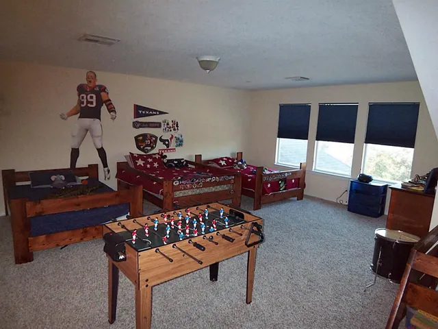 a bedroom with furniture and a window