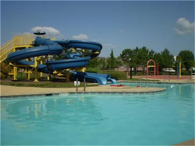 a living room with furniture and large window