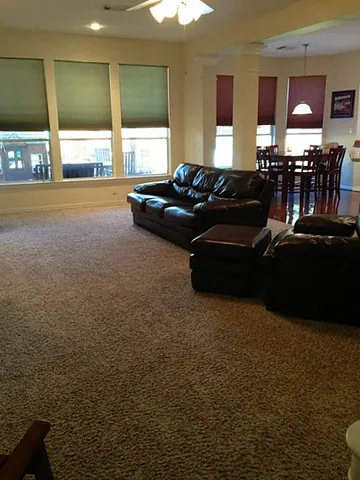 a bedroom with a bed and a night stand