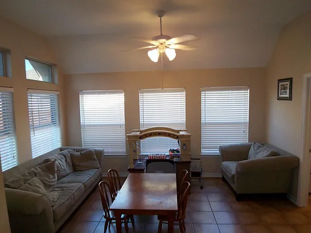 a living room with furniture and window