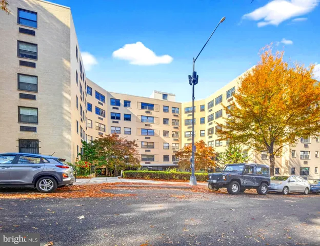 a view of a cars parked in front of a building