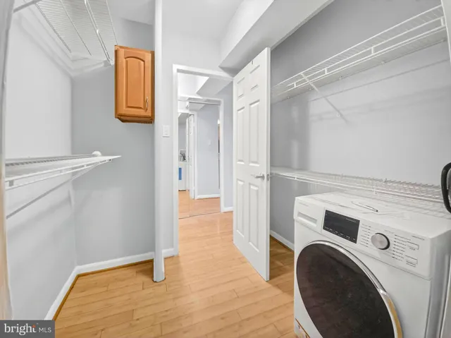 a view of hallway with washer and dryer