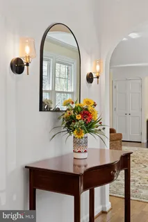 a room with pool table and windows