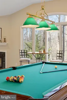 a living room with furniture and a lamp