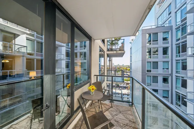 a balcony view with couple of chairs